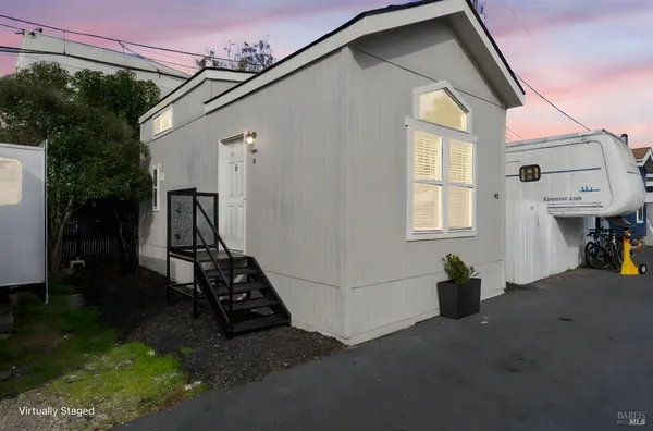 a view of a backyard of the house