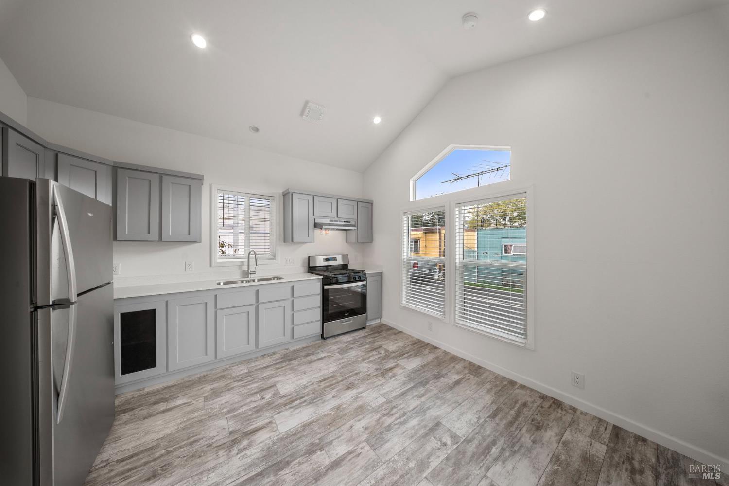 742 Francisco Boulevard West, Unit B12 San Rafael, CA 94901 - Photo 6 of 16 a kitchen with stainless steel appliances a refrigerator and a sink