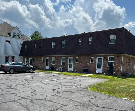 a house view with a sitting space and garden space