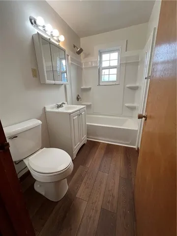 a bathroom with a toilet a sink and a bathtub