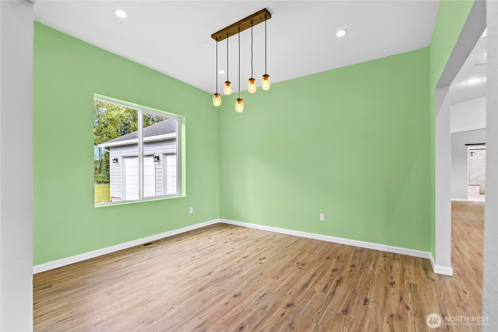 249 Flatt Road Kelso, WA 98626 - Photo 8 of 39 wooden floor in an empty room with a window