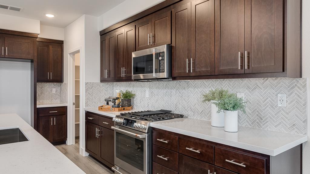 338 Line Street Hayward, CA 94544 - Photo 14 of 25 a kitchen with stainless steel appliances granite countertop a refrigerator stove and microwave