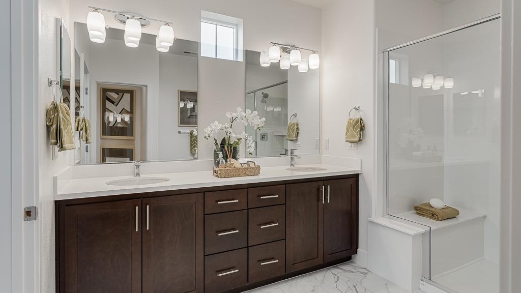 338 Line Street Hayward, CA 94544 - Photo 20 of 25 a bathroom with a granite countertop sink a mirror and a shower
