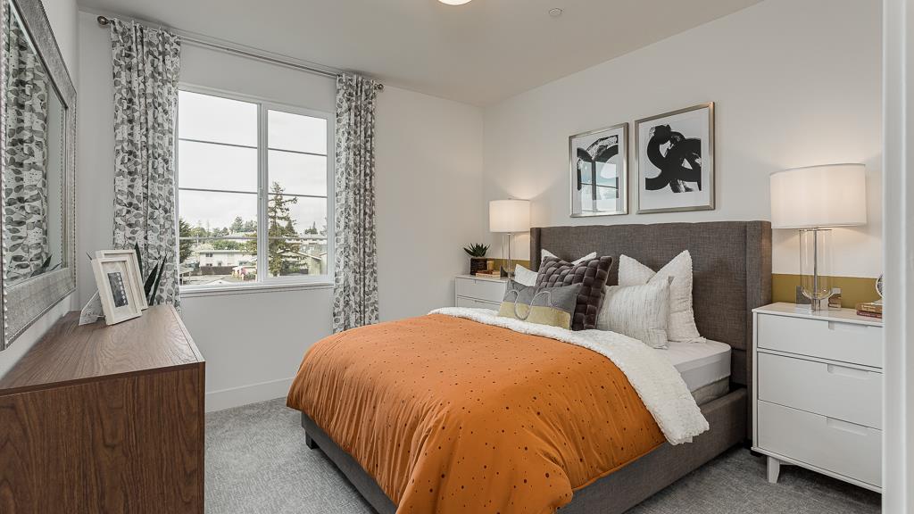 338 Line Street Hayward, CA 94544 - Photo 22 of 25 a bed sitting in a bedroom next to a window