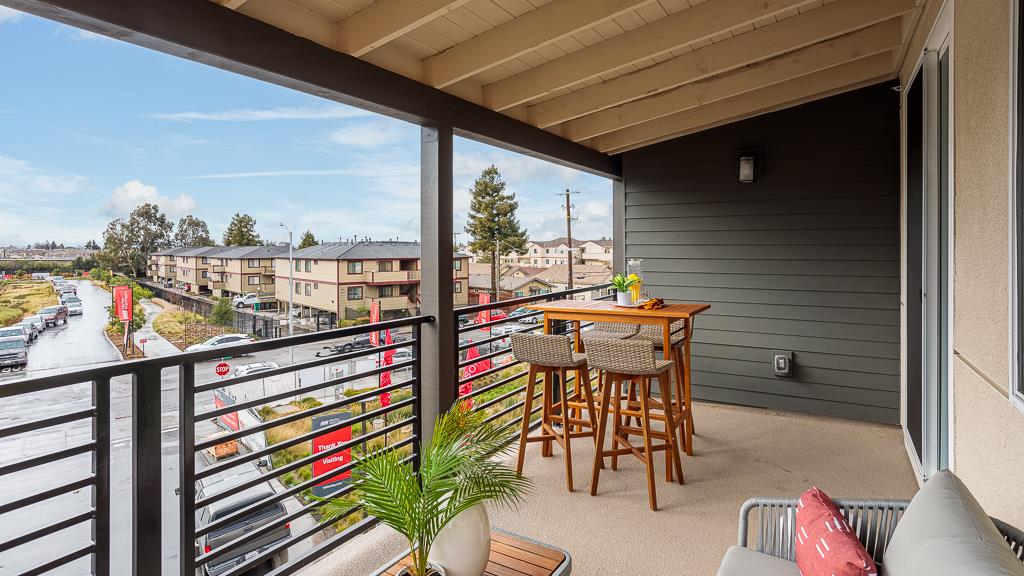 338 Line Street Hayward, CA 94544 - Photo 10 of 25 a balcony with furniture and a potted plant