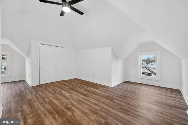 a view of an entryway with wooden floor