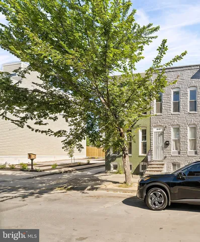 a car parked in front of a house