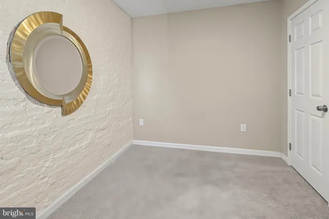 an empty room with a mirror