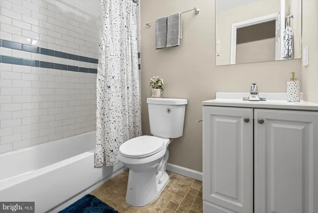 a bathroom with a sink toilet and bathtub