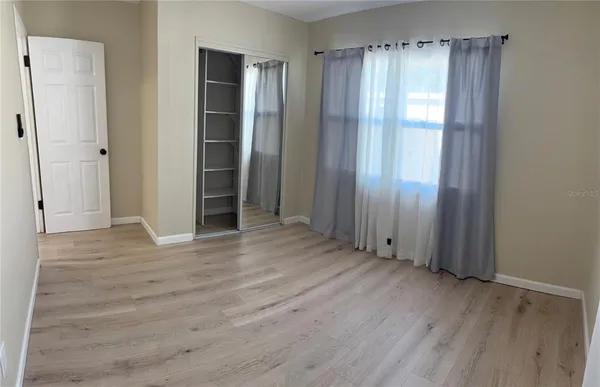a view of entryway with wooden floor