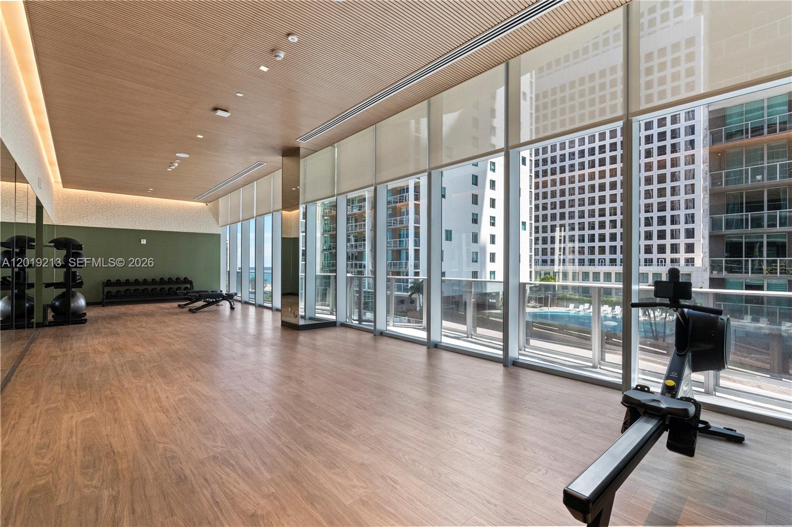 77 Southeast 5th, Unit 3702 Miami, FL 33131 - Photo 46 of 63 a view of a room with gym equipment
