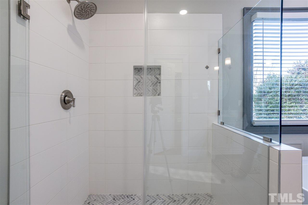8704 Old Tom Way Raleigh, NC 27613 - Photo 8 of 30 a bathroom with a shower