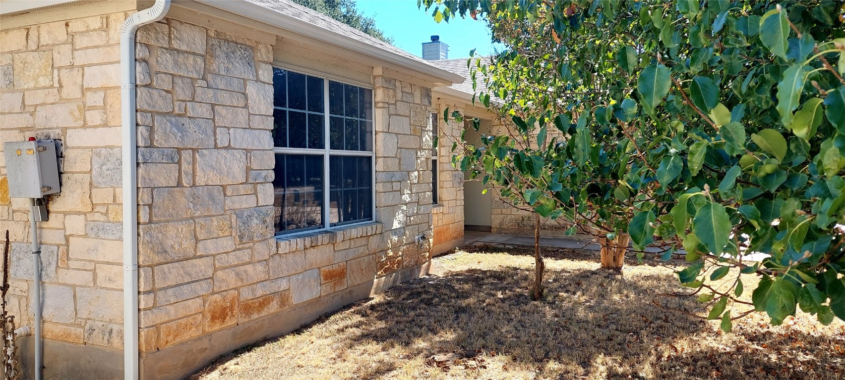 4 Memory Lane Wimberley, TX 78676 - Photo 15 of 20 a view of house with backyard and a tree