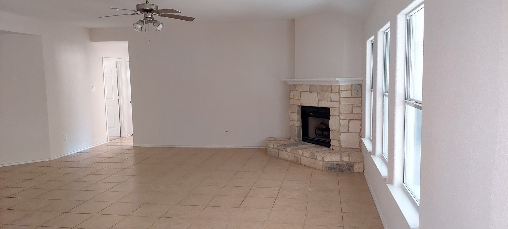 4 Memory Lane Wimberley, TX 78676 - Photo 16 of 20 an empty room with windows and fireplace