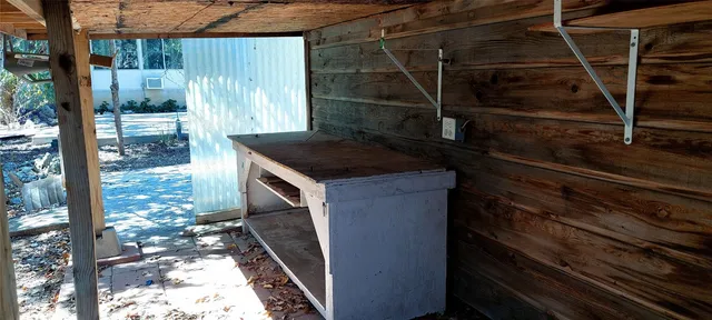 a kitchen with a sink and a wooden floor