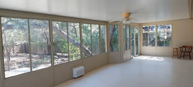 a view of a room with balcony and furniture