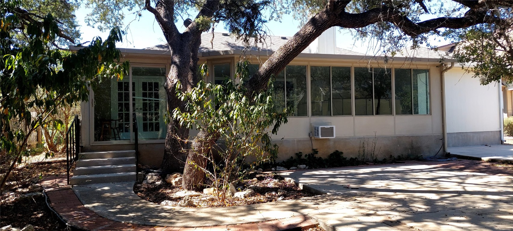 4 Memory Lane Wimberley, TX 78676 - Photo 7 of 20 a view of a house with a tree in front