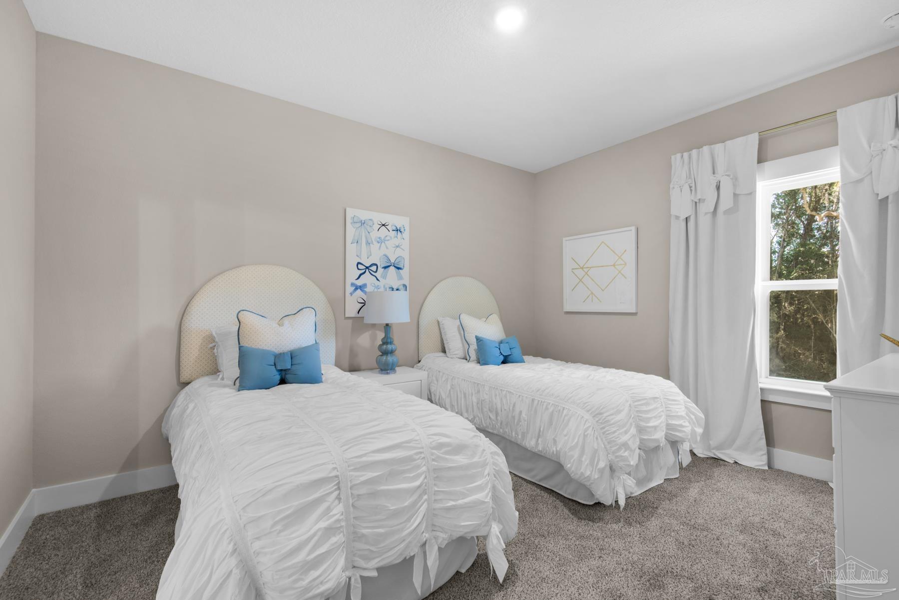 5912 Greenfield Street Pace, FL 32571 - Photo 11 of 47 a bedroom with two beds and a large window