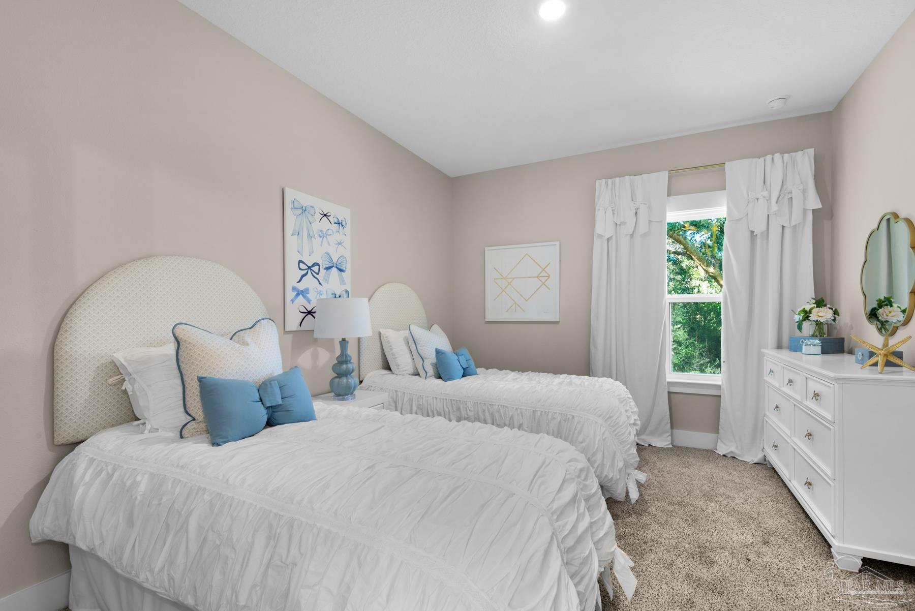 5912 Greenfield Street Pace, FL 32571 - Photo 12 of 47 a bedroom with a bed and a large window