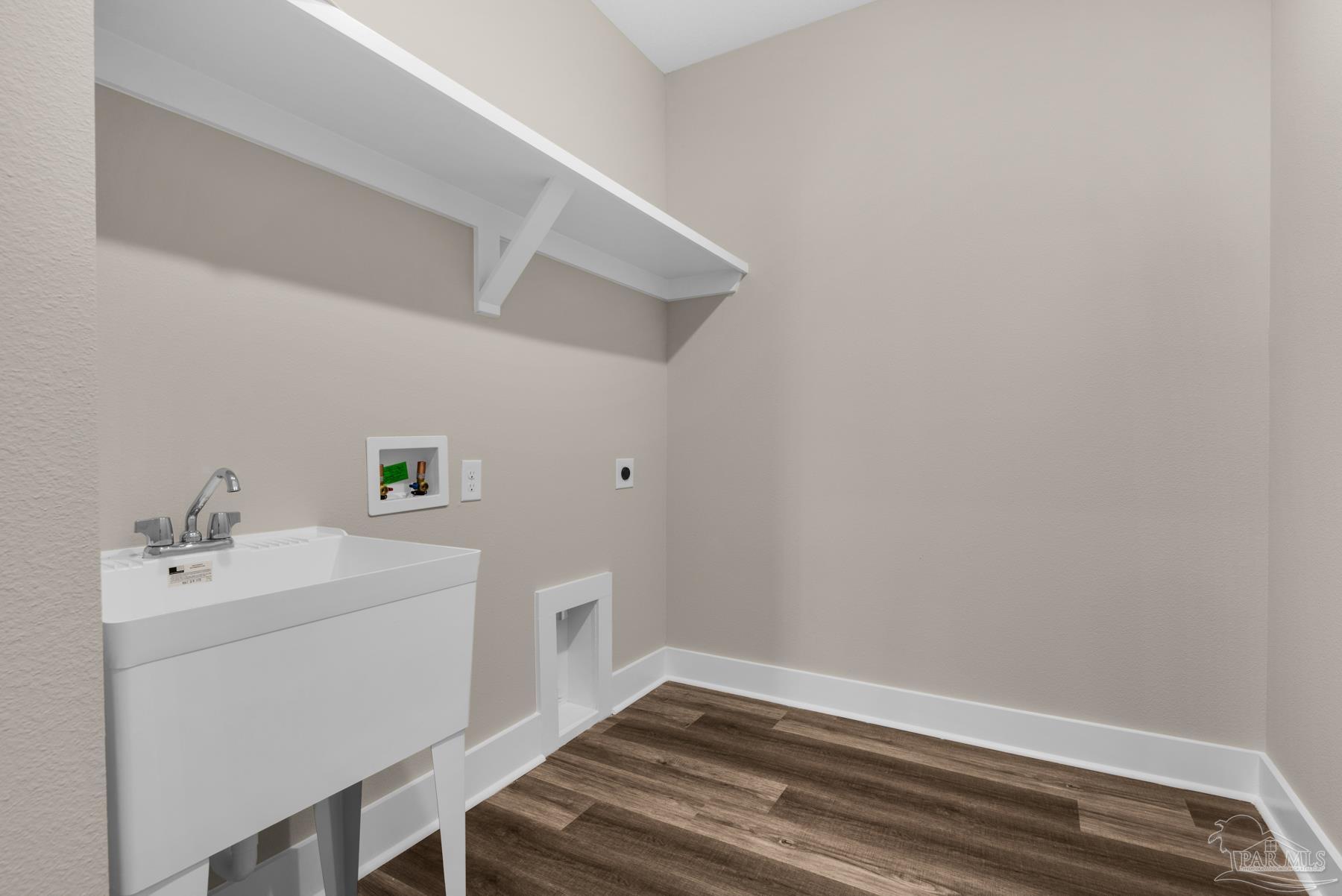 5912 Greenfield Street Pace, FL 32571 - Photo 23 of 47 a utility room with a sink