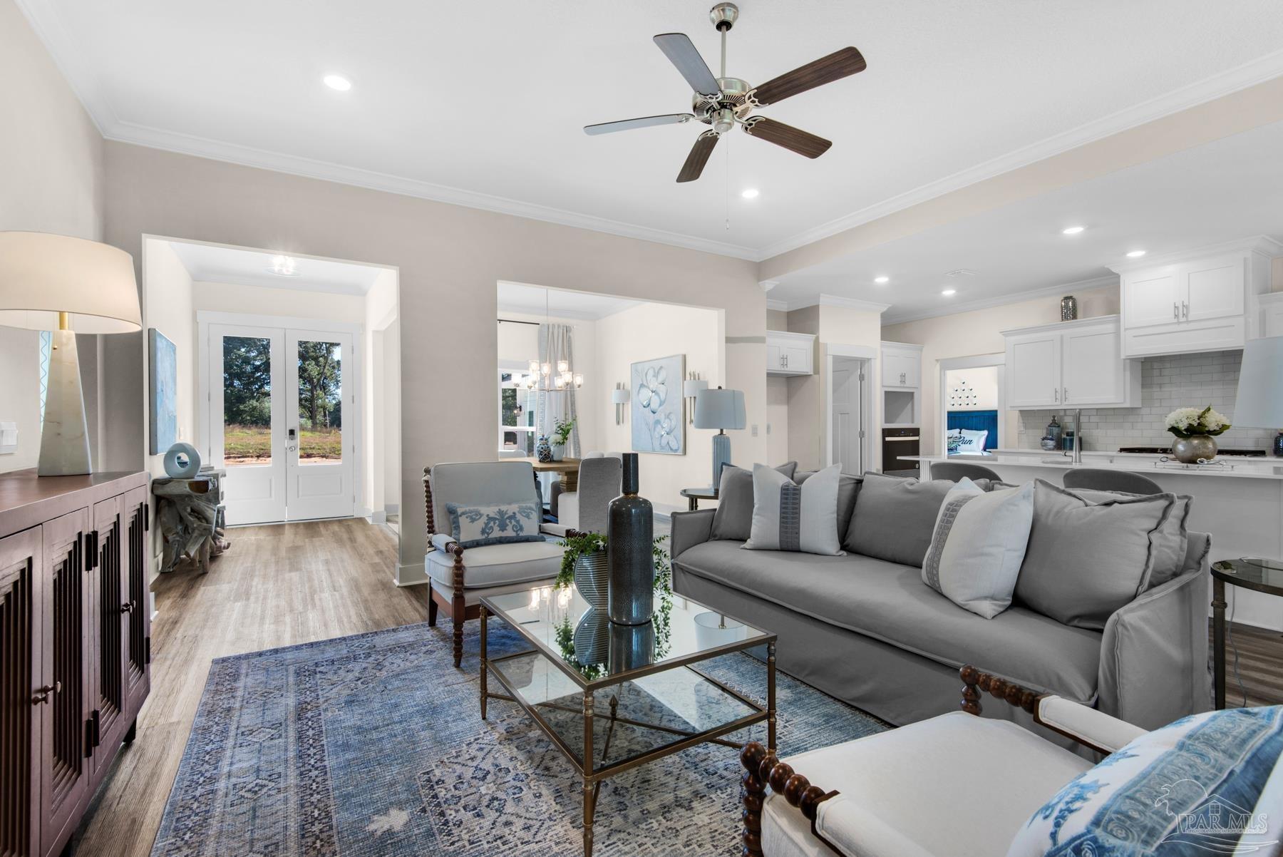 5912 Greenfield Street Pace, FL 32571 - Photo 3 of 47 a living room with furniture and a view of kitchen