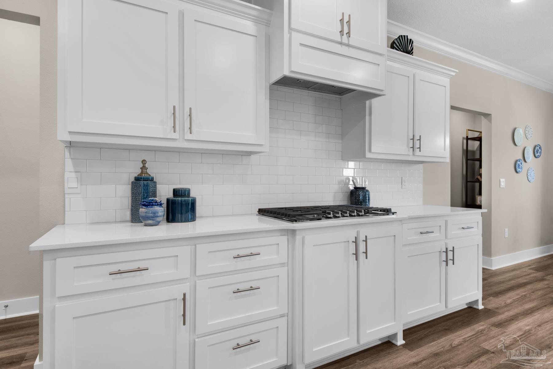 5912 Greenfield Street Pace, FL 32571 - Photo 32 of 47 a kitchen with white cabinets and white appliances