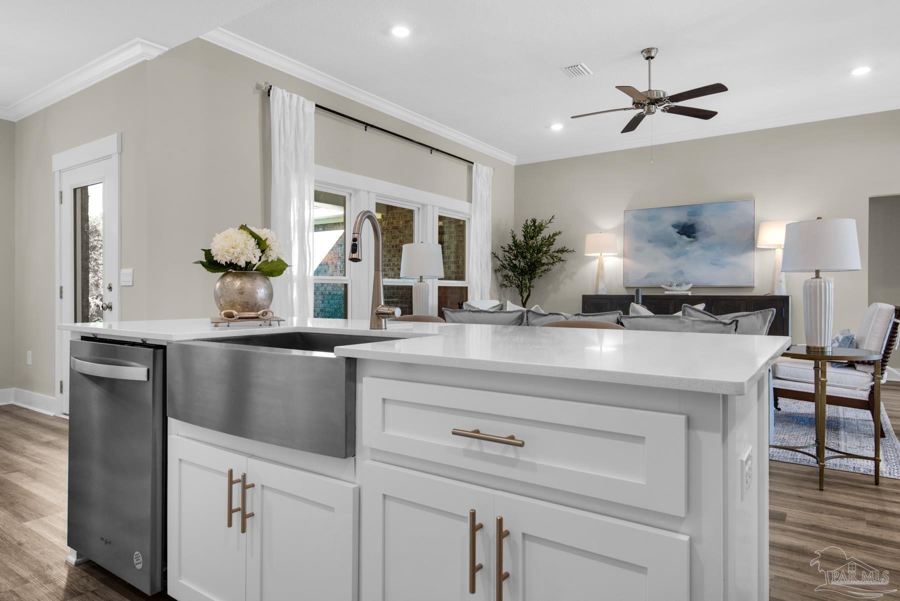 5912 Greenfield Street Pace, FL 32571 - Photo 33 of 47 a kitchen with a refrigerator and a sink