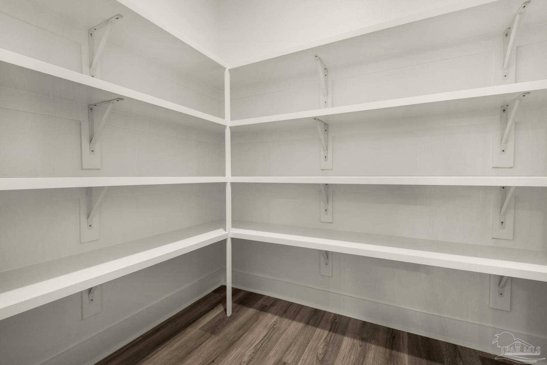 5912 Greenfield Street Pace, FL 32571 - Photo 35 of 47 a view of walk in closet with empty racks