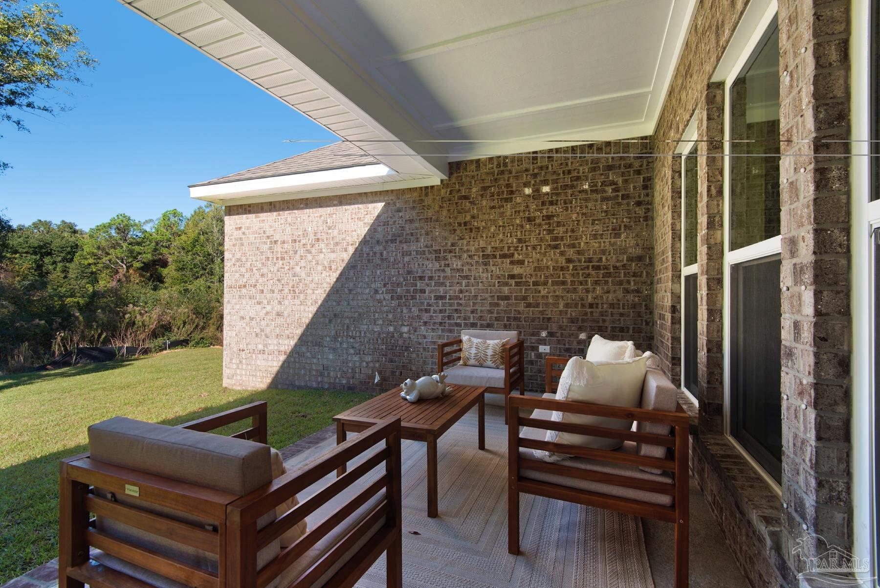 5912 Greenfield Street Pace, FL 32571 - Photo 45 of 47 a outdoor living space with furniture