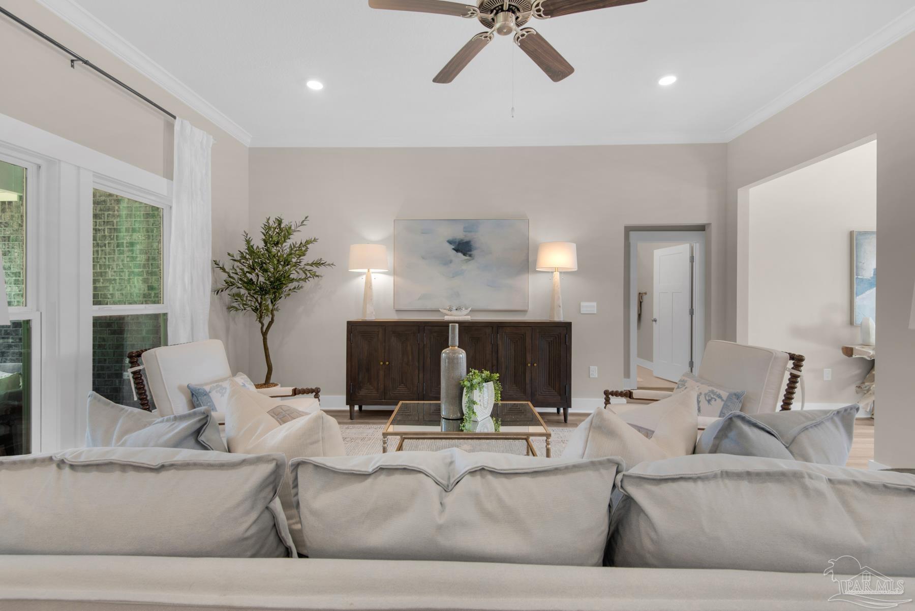 5912 Greenfield Street Pace, FL 32571 - Photo 8 of 47 a living room with furniture and a fireplace