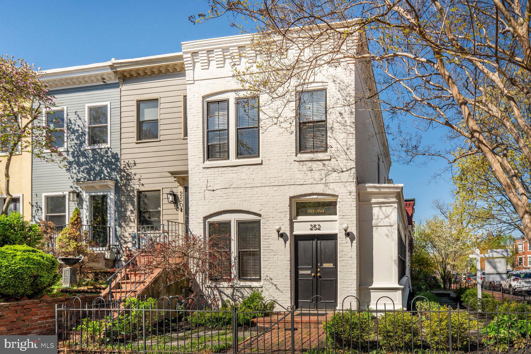 front view of a house with a tree