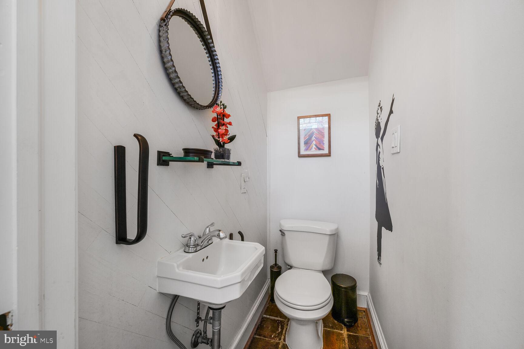 252 10th Street Northeast Washington, DC 20002 - Photo 13 of 31 a bathroom with a sink mirror and toilet