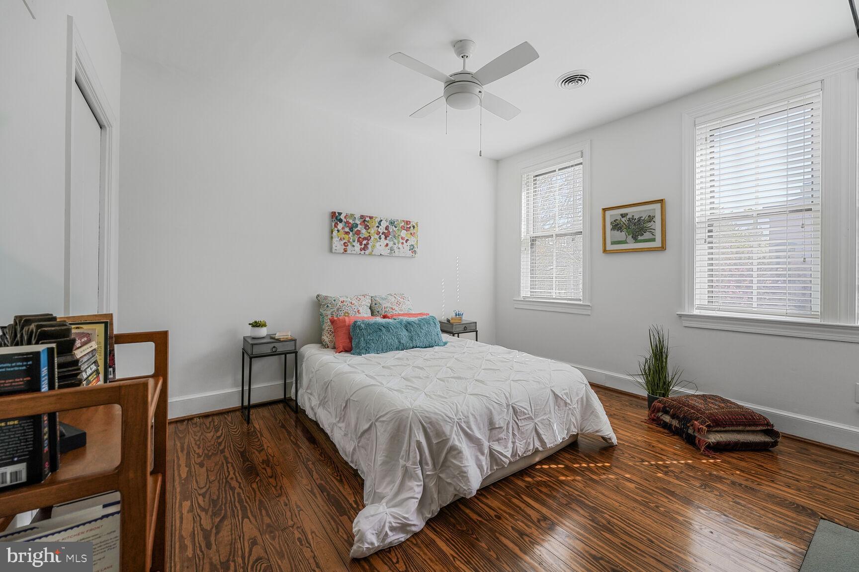 252 10th Street Northeast Washington, DC 20002 - Photo 16 of 31 a bedroom with a bed and a wooden floor