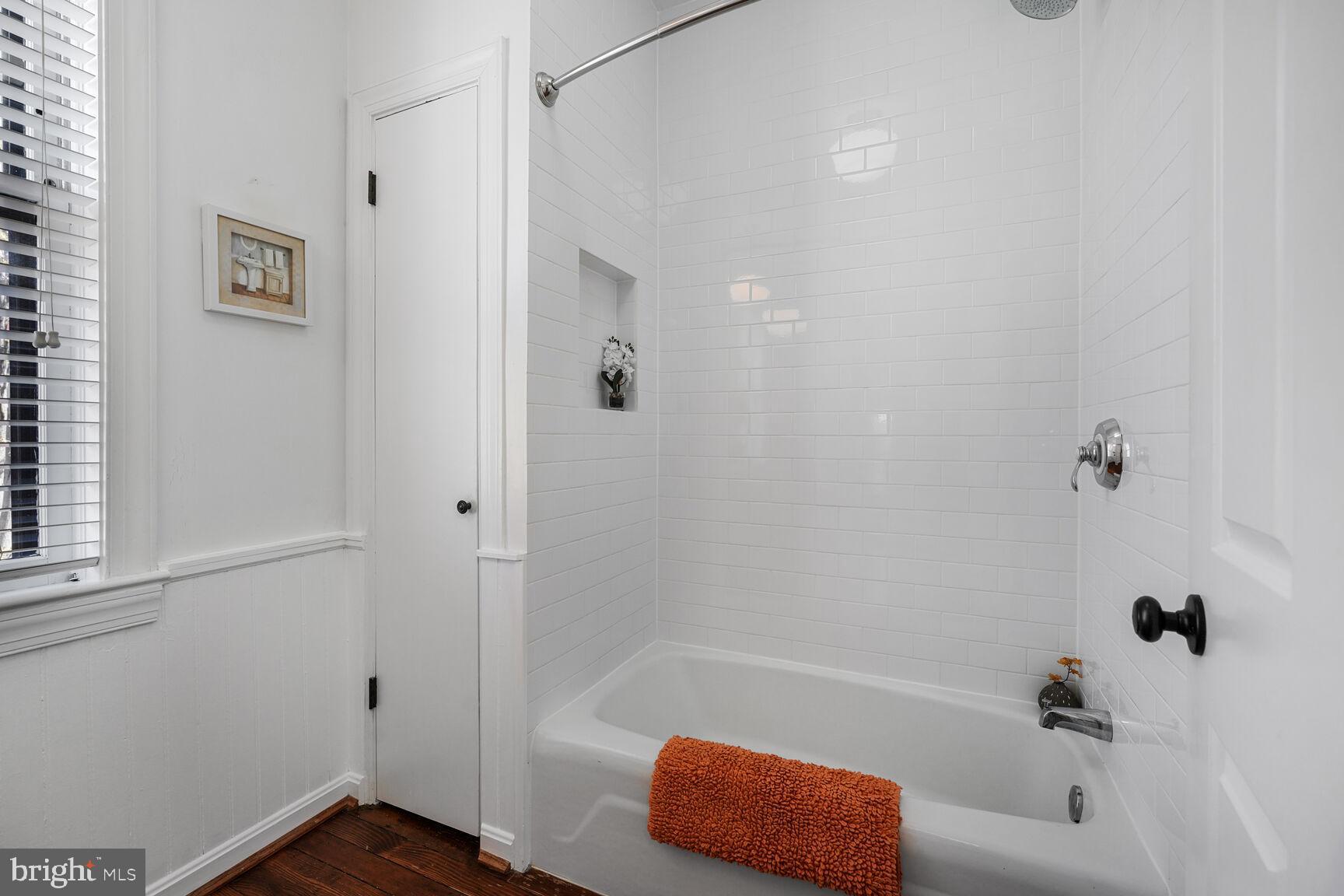 252 10th Street Northeast Washington, DC 20002 - Photo 20 of 31 a bathroom with a tub and shower