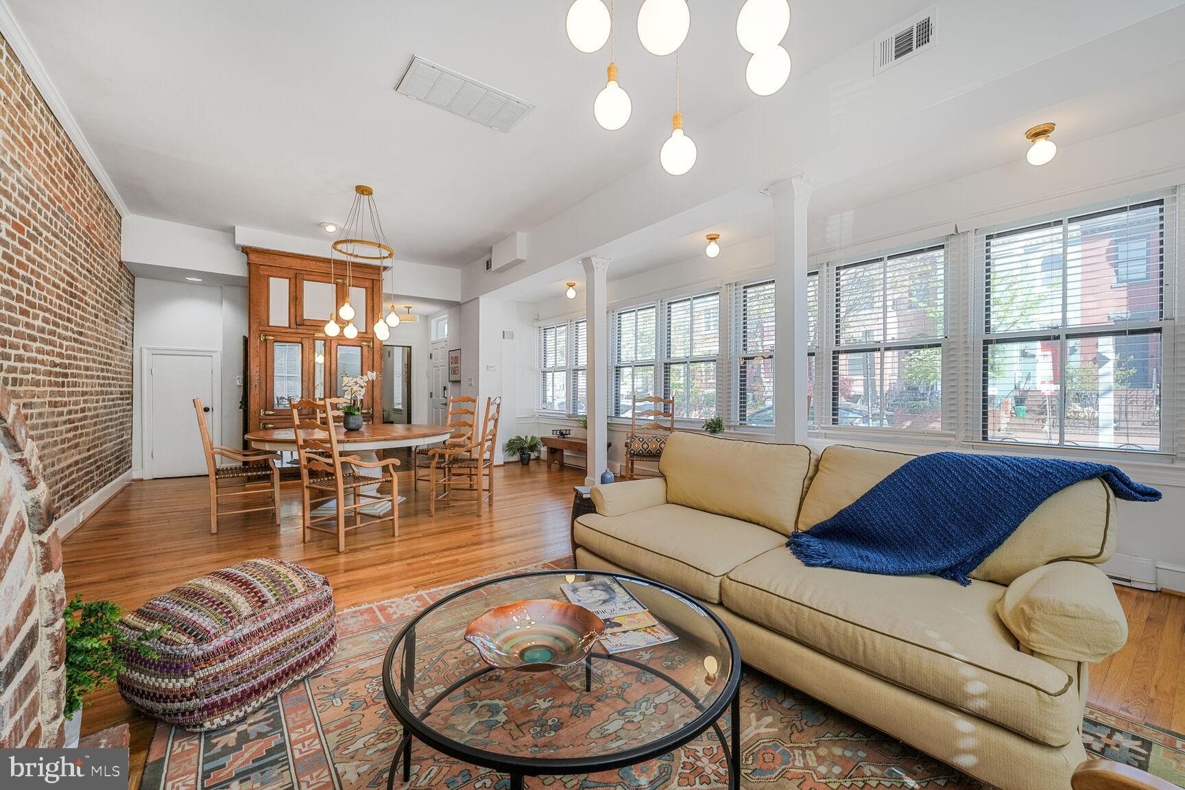 252 10th Street Northeast Washington, DC 20002 - Photo 6 of 31 a living room with furniture and wooden floor