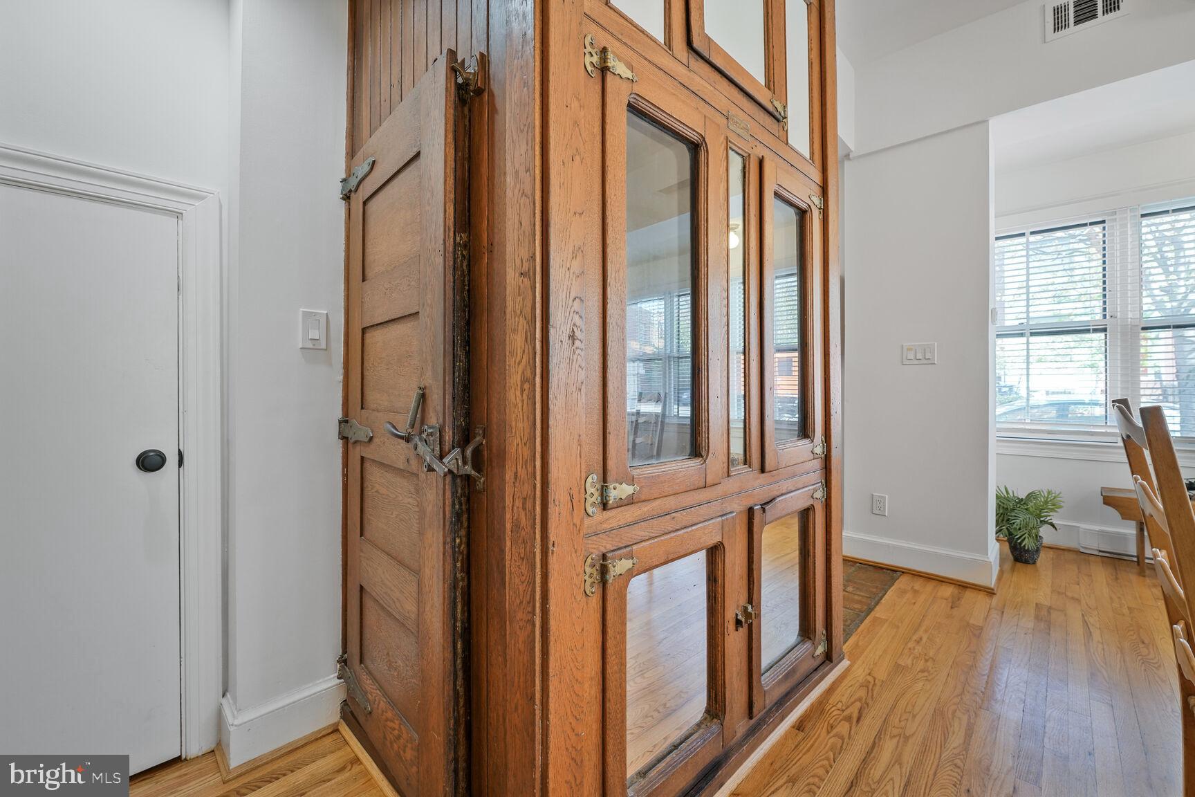 252 10th Street Northeast Washington, DC 20002 - Photo 8 of 31 a view of a hallway with wooden floor and staircase