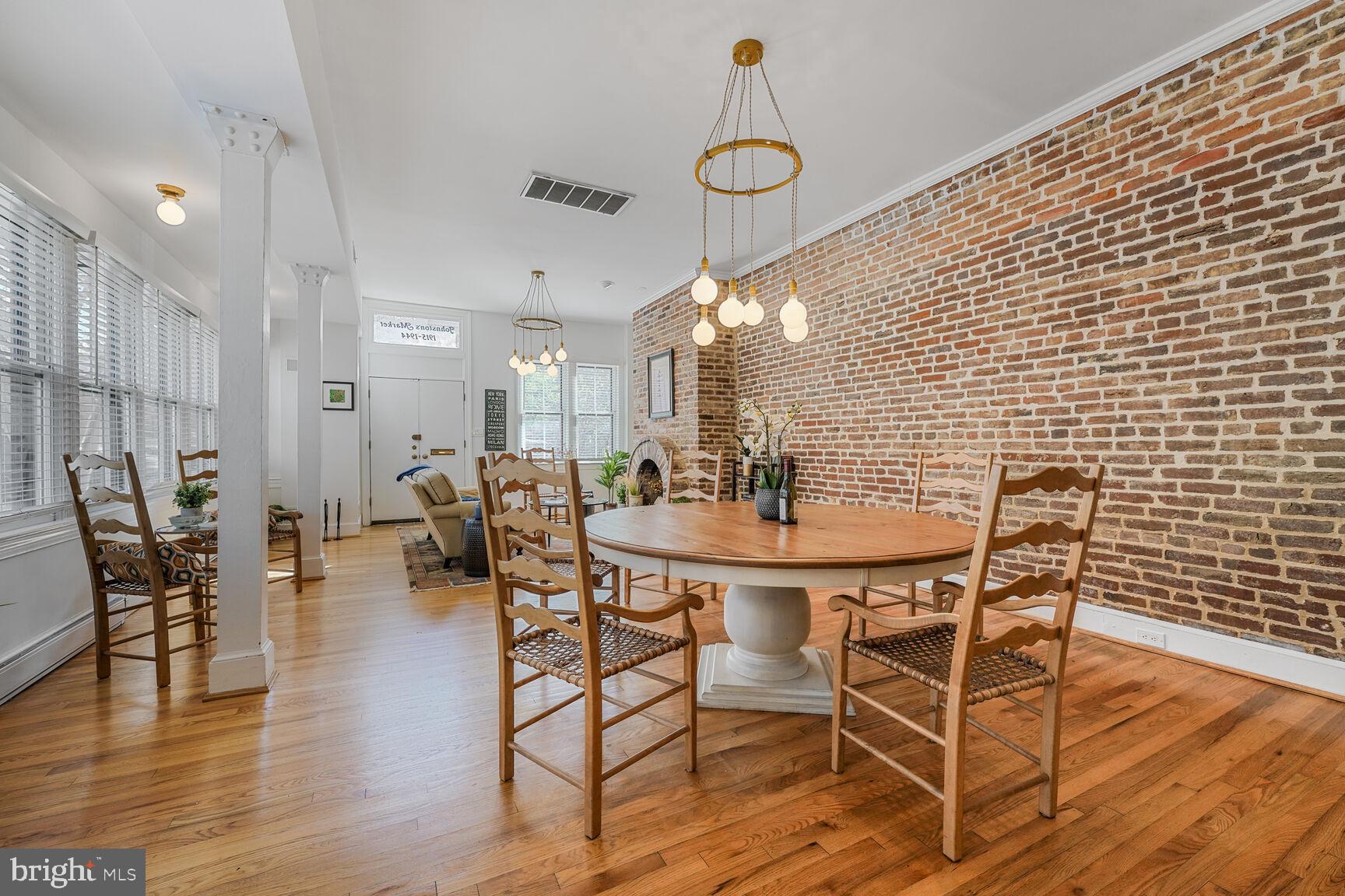 252 10th Street Northeast Washington, DC 20002 - Photo 9 of 31 a dining room with furniture and wooden floor