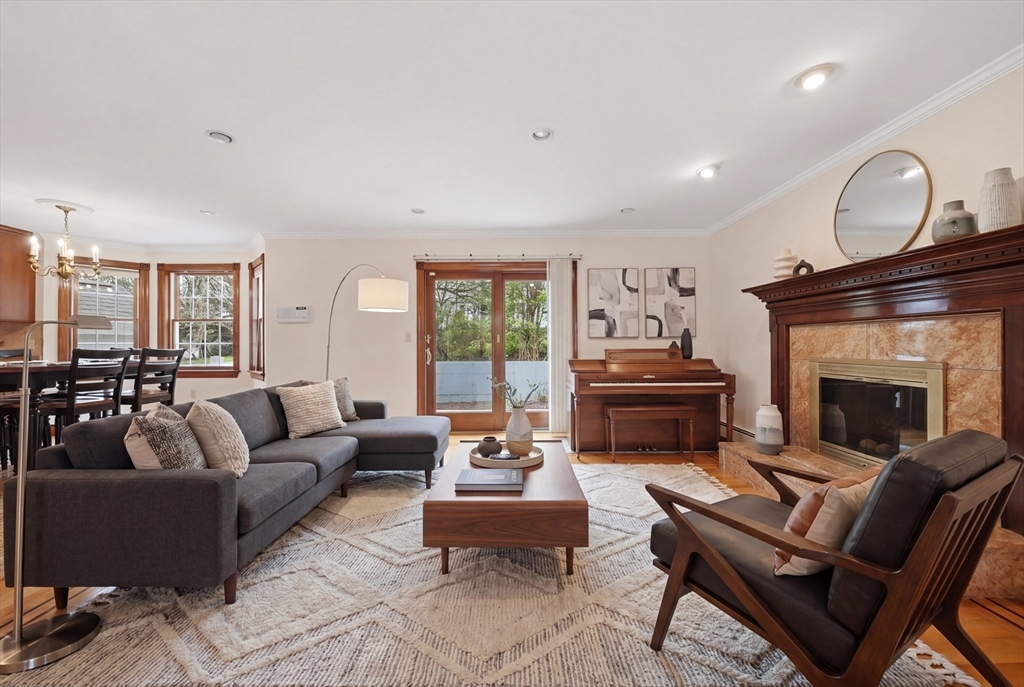 131 Range Heights Road Lynn, MA 01904 - Photo 8 of 36 a living room with furniture and a fireplace