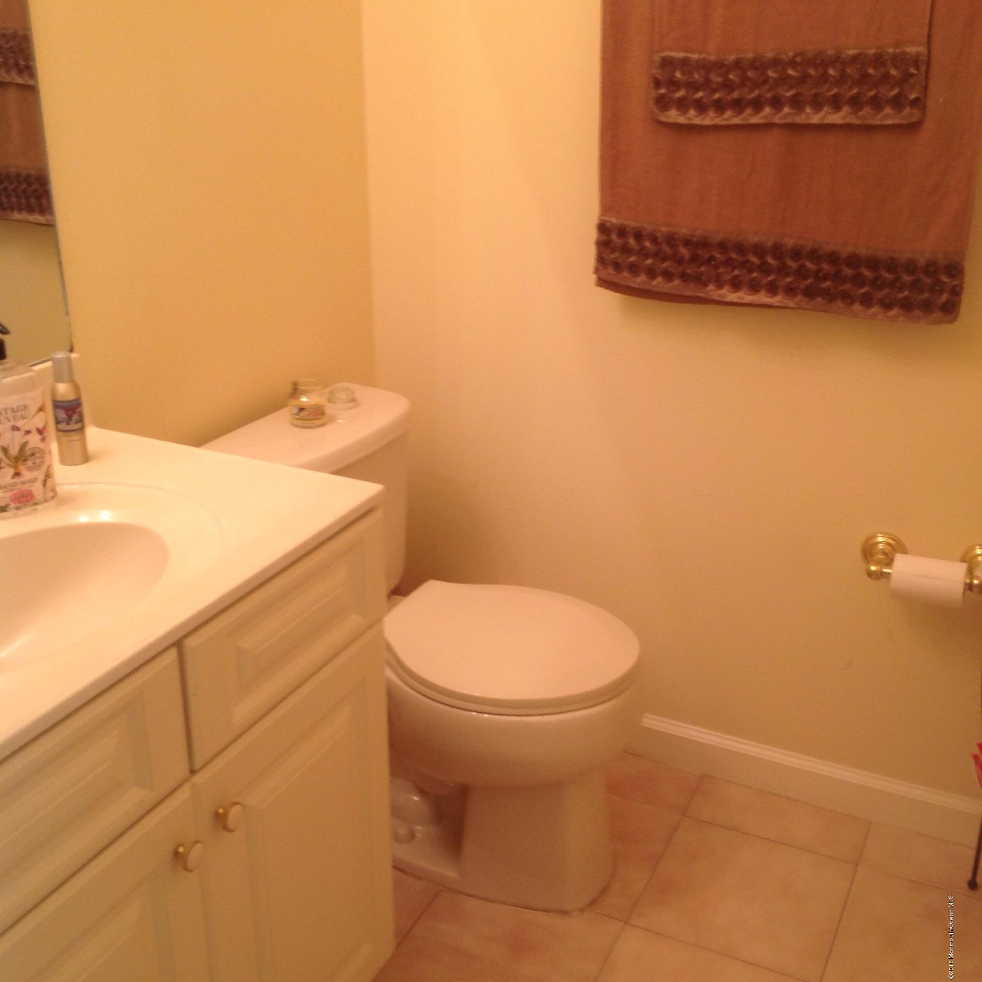 811 Cassville Road Jackson, NJ 08527 - Photo 18 of 88 a bathroom with a toilet a sink and mirror