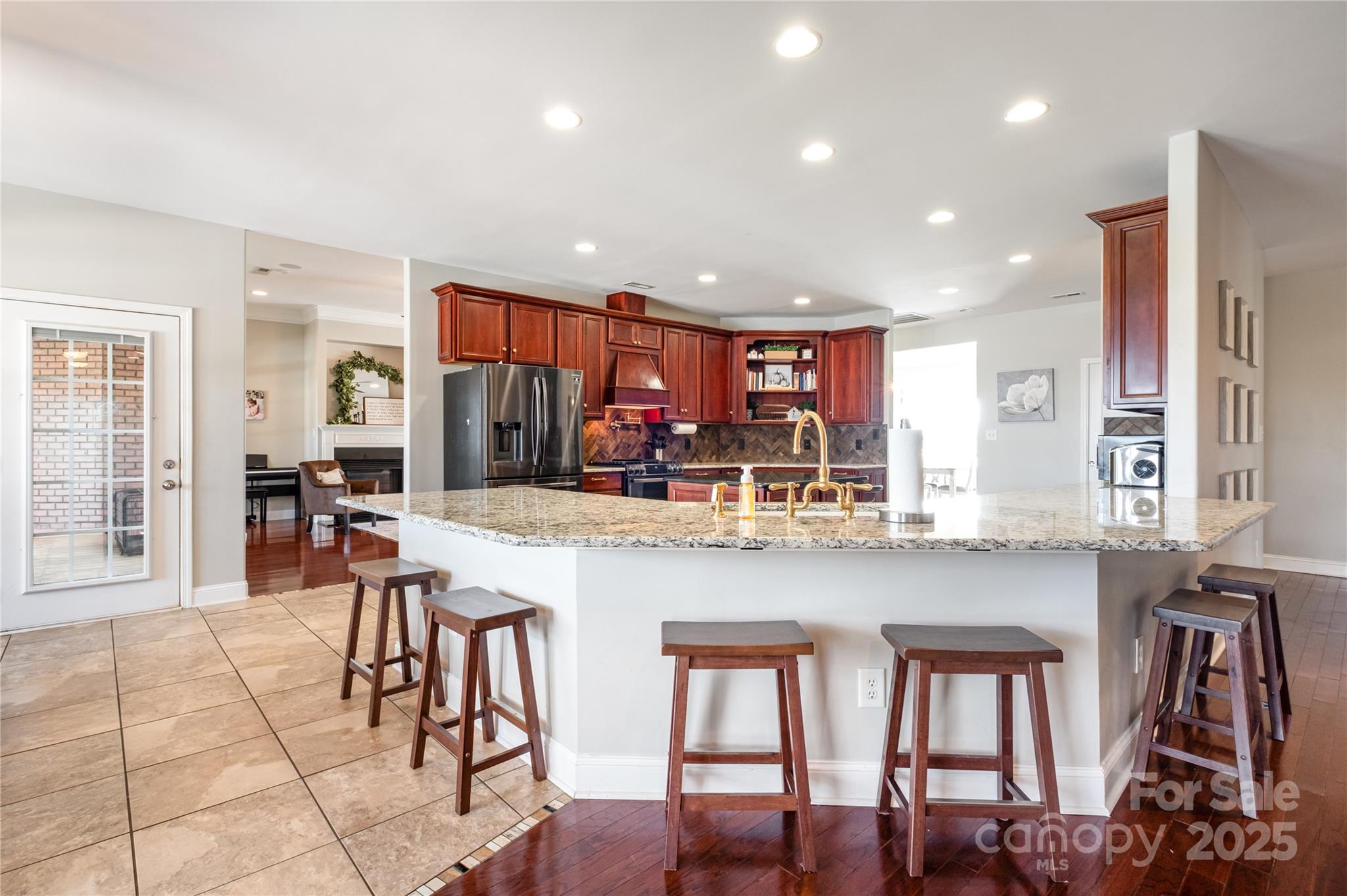 167 Black Road Statesville, NC 28677 - Photo 16 of 48 a kitchen with stainless steel appliances granite countertop a table chairs and a refrigerator