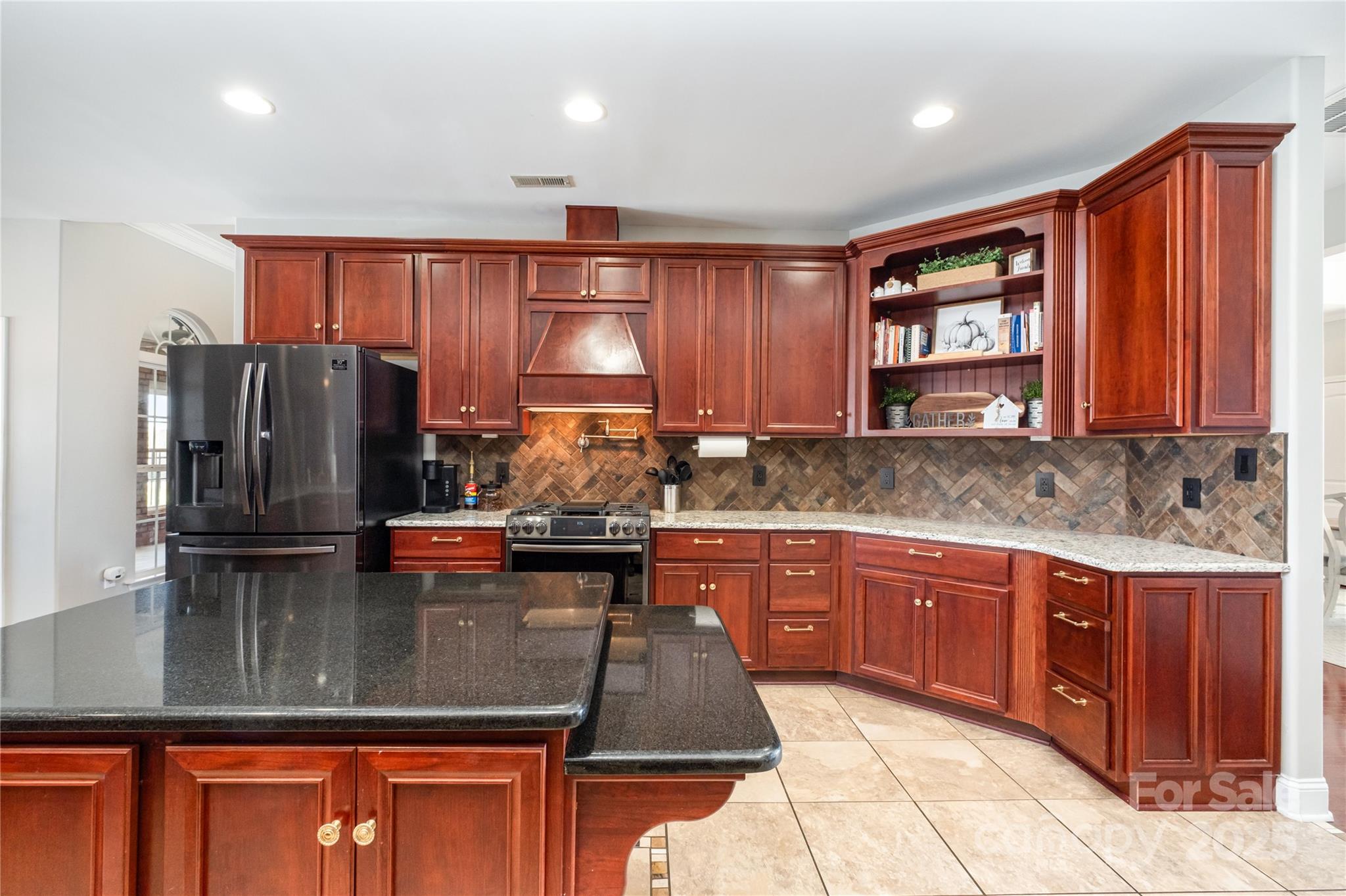 167 Black Road Statesville, NC 28677 - Photo 19 of 48 a kitchen with stainless steel appliances granite countertop a refrigerator a sink dishwasher a stove with wooden cabinets and floor