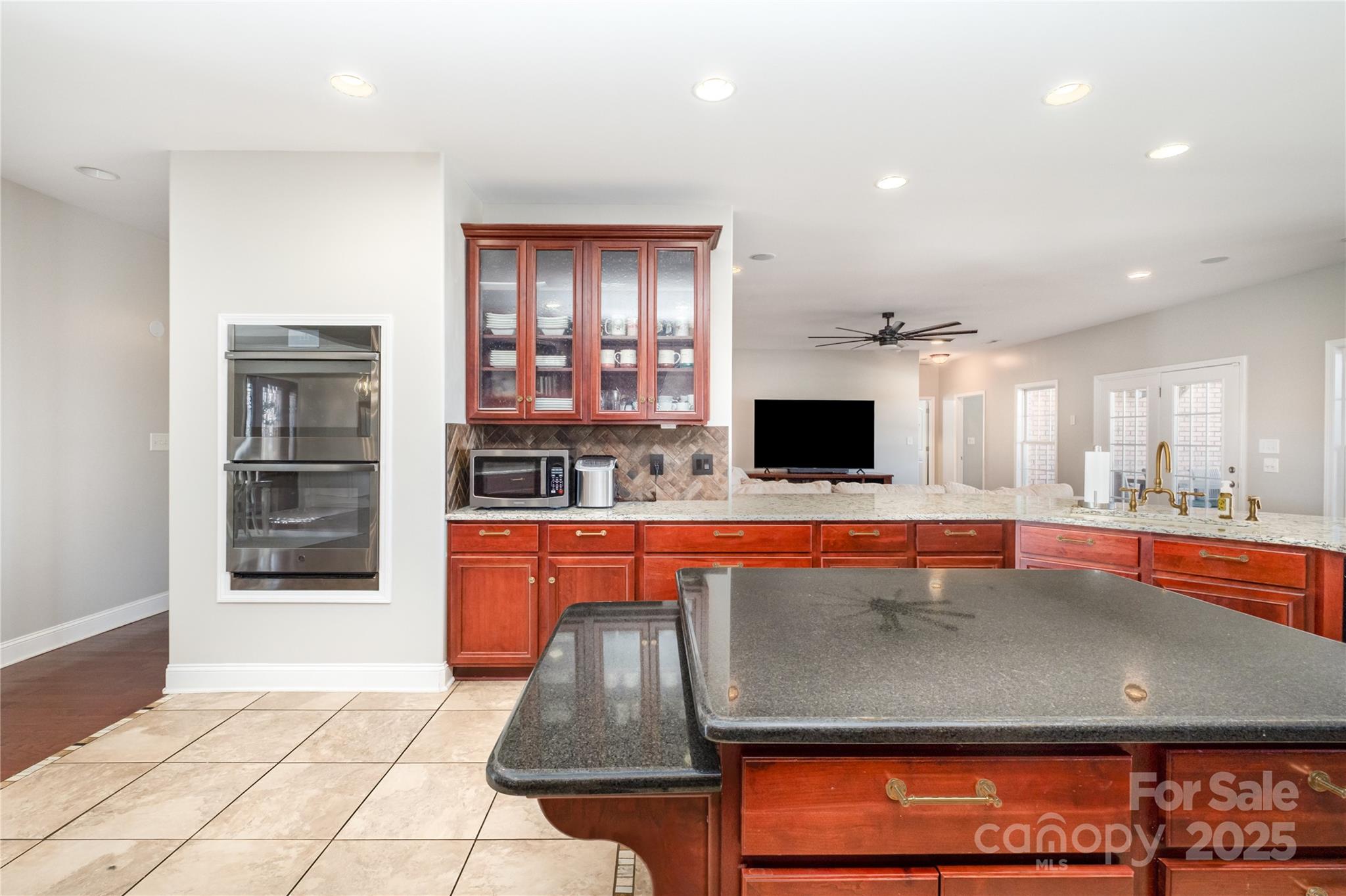 167 Black Road Statesville, NC 28677 - Photo 20 of 48 a kitchen with stainless steel appliances granite countertop a stove and a sink
