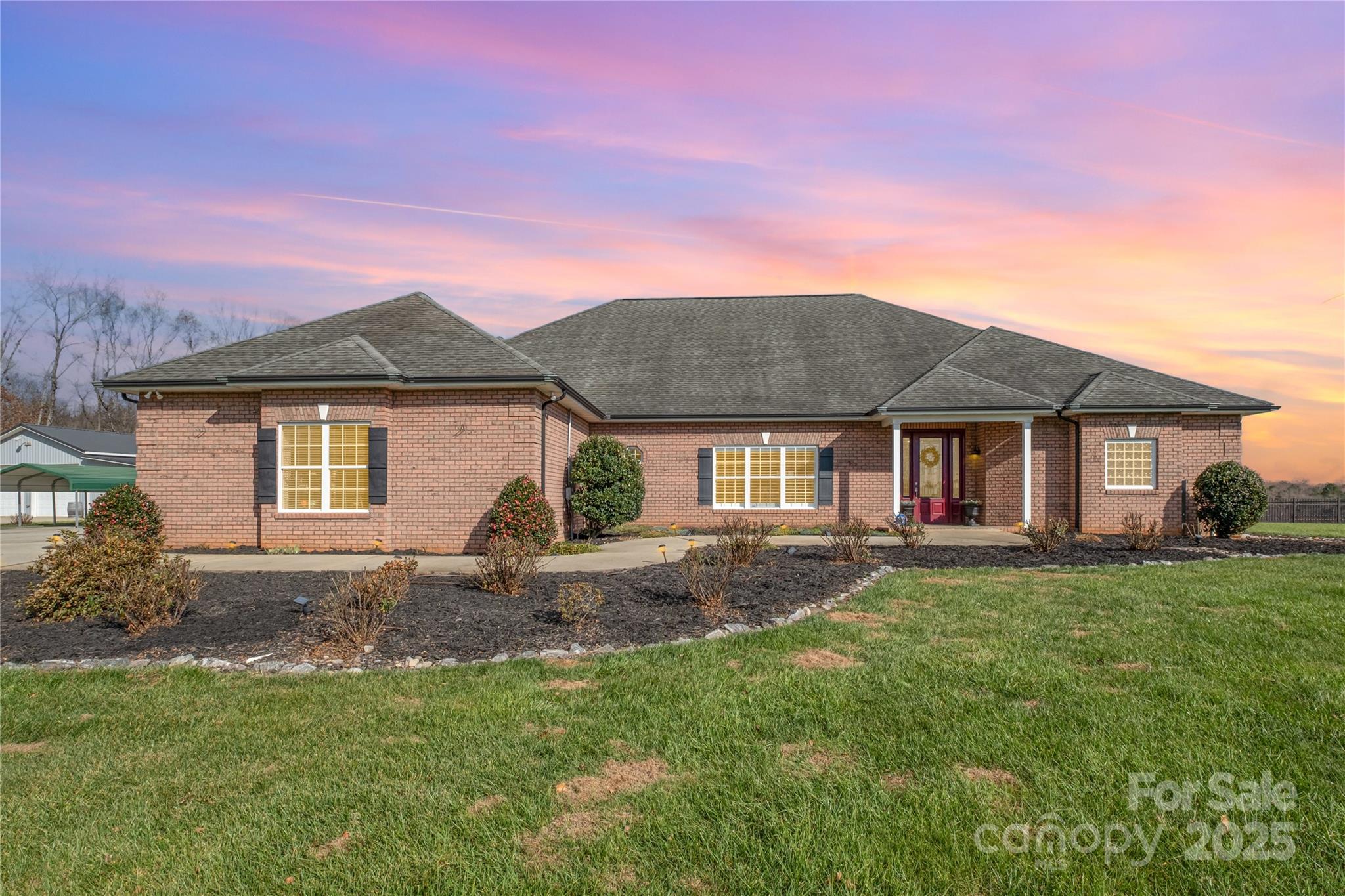 167 Black Road Statesville, NC 28677 - Photo 2 of 48 a front view of a house with a garden and yard