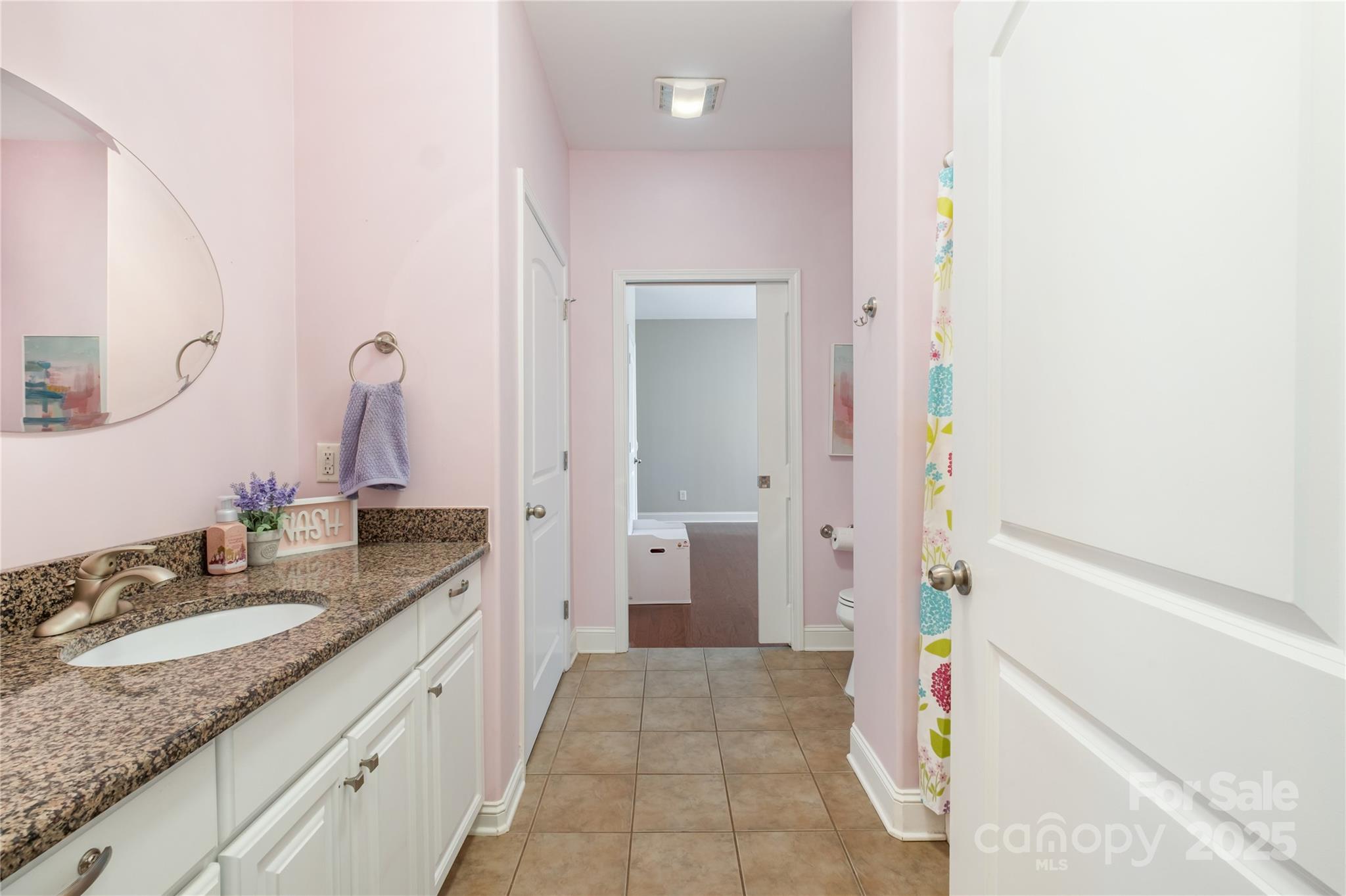 167 Black Road Statesville, NC 28677 - Photo 34 of 48 a spacious bathroom with a granite countertop sink and a mirror