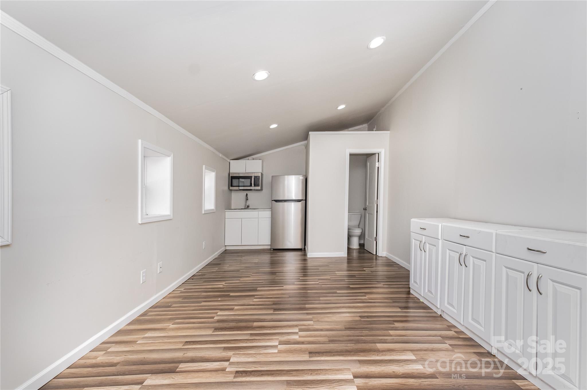 167 Black Road Statesville, NC 28677 - Photo 42 of 48 a view of an empty room with wooden floor