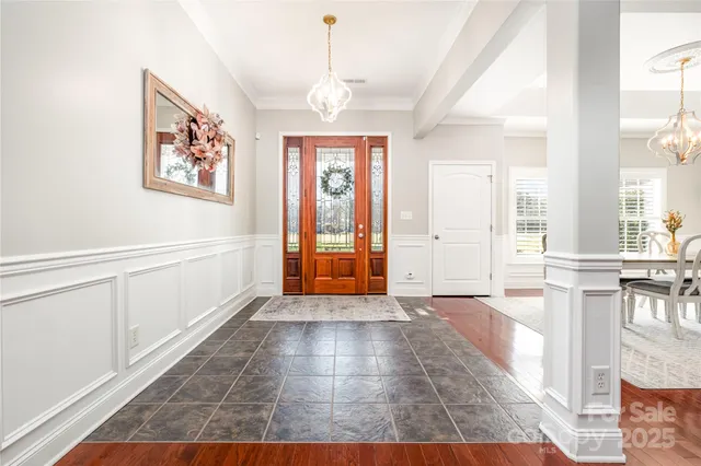 a view of an entryway with wooden floor