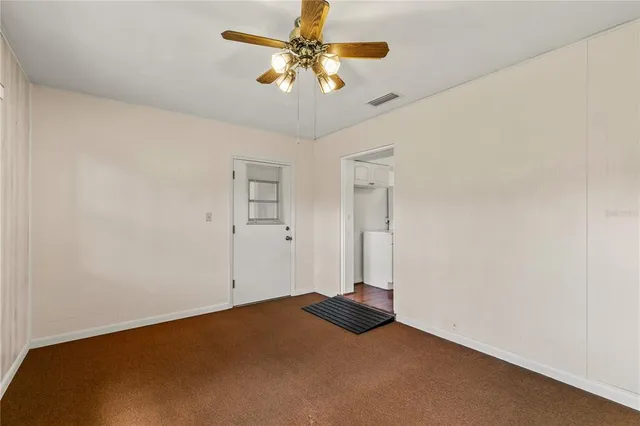 a view of a big room with carpet