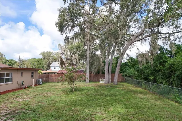 a backyard of a house with lots of green space