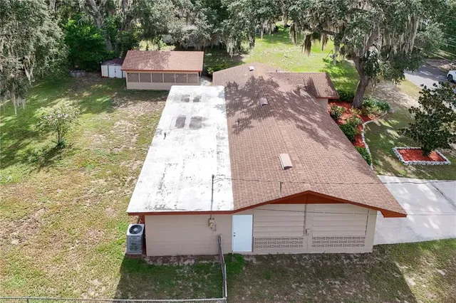 a aerial view of a house with a yard