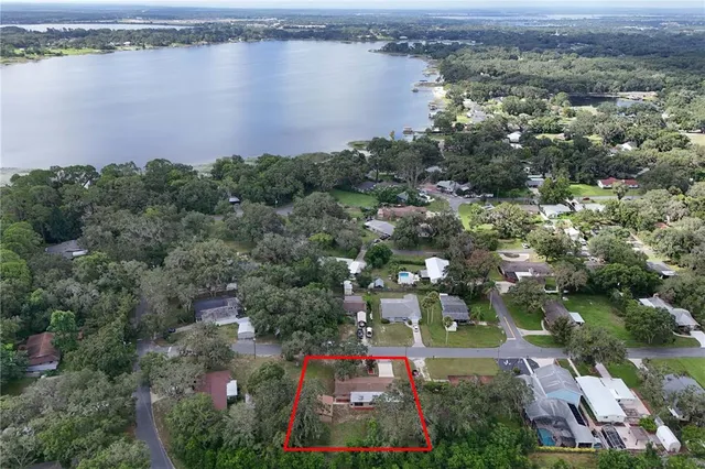 an aerial view of a city and lake view